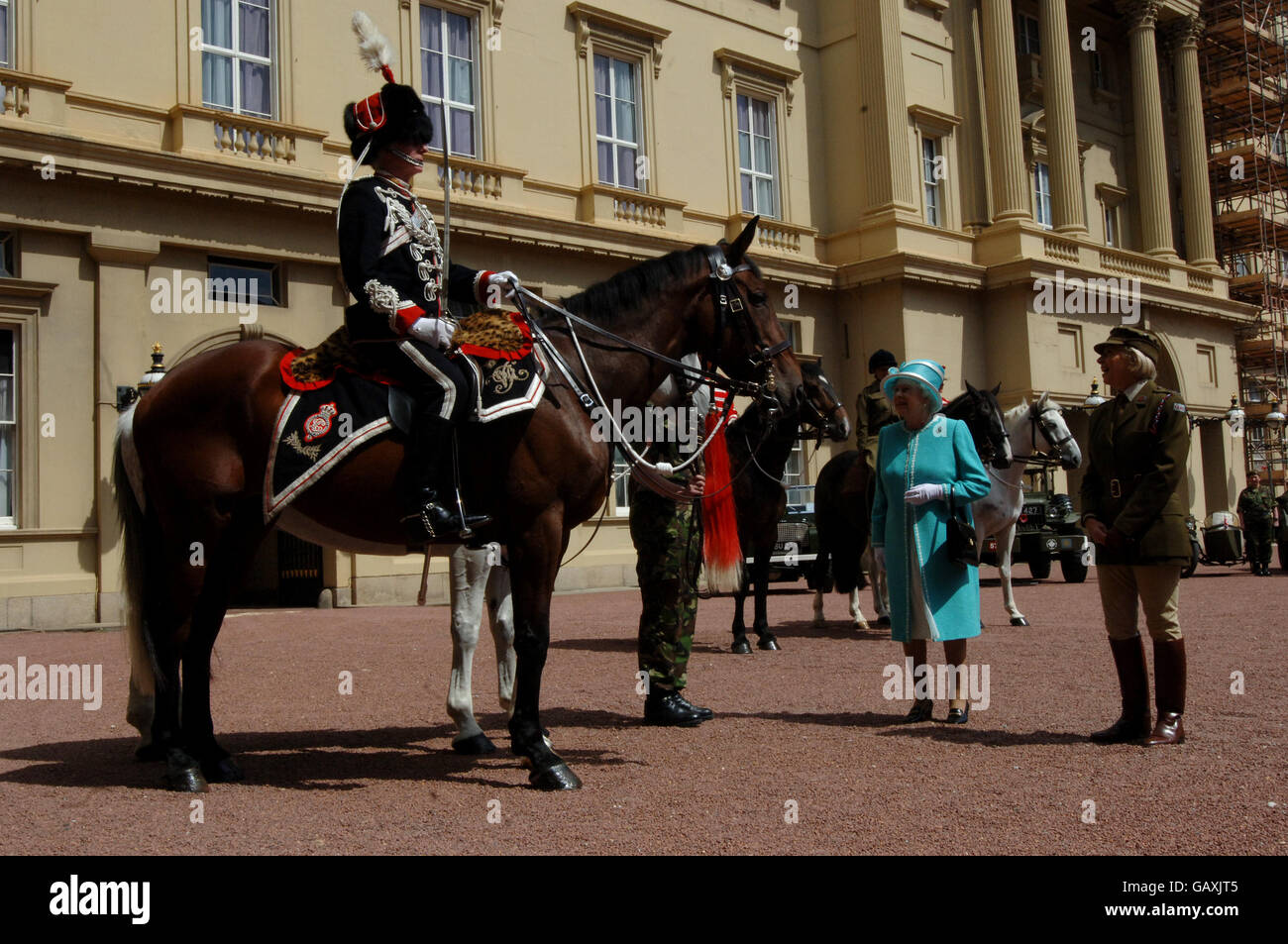 Britain's Queen Elizabeth II, inspects vintage vehicles used by the First Aid Nursing Yeomanry during WWII, which were assembled in the quadrangle of Buckingham Palace, London. Stock Photo