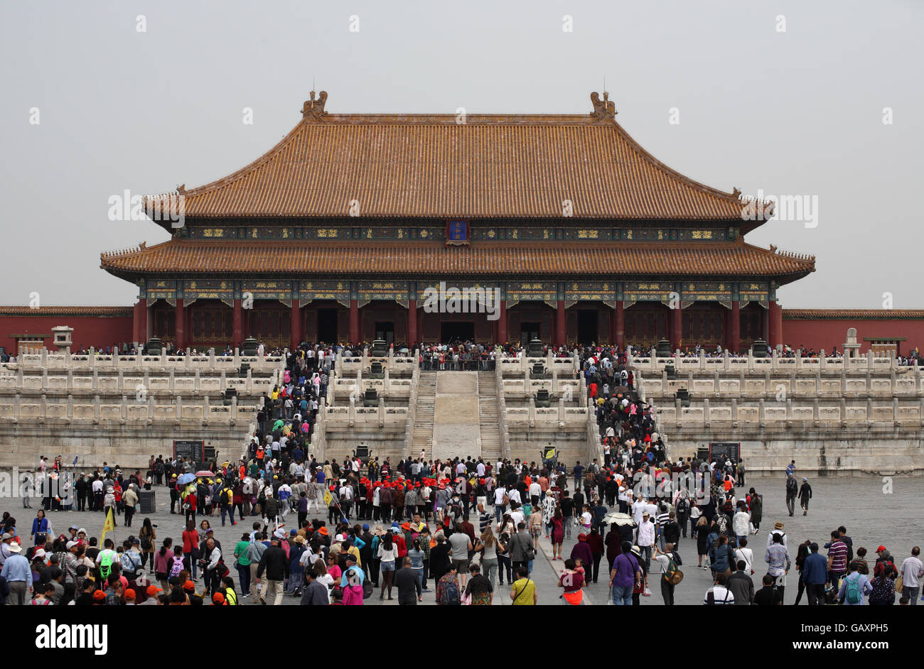 Many tourists are walking to the Hall of Supreme Harmony in the Forbidden City, in front of the hall is the dragon steps ramp Stock Photo