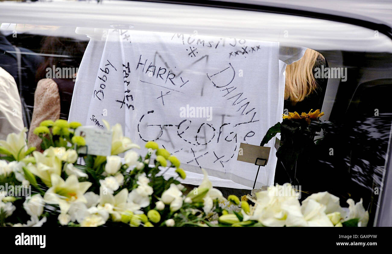 Flowers and tributes to murdered schoolboy Jimmy Mizen attached to the