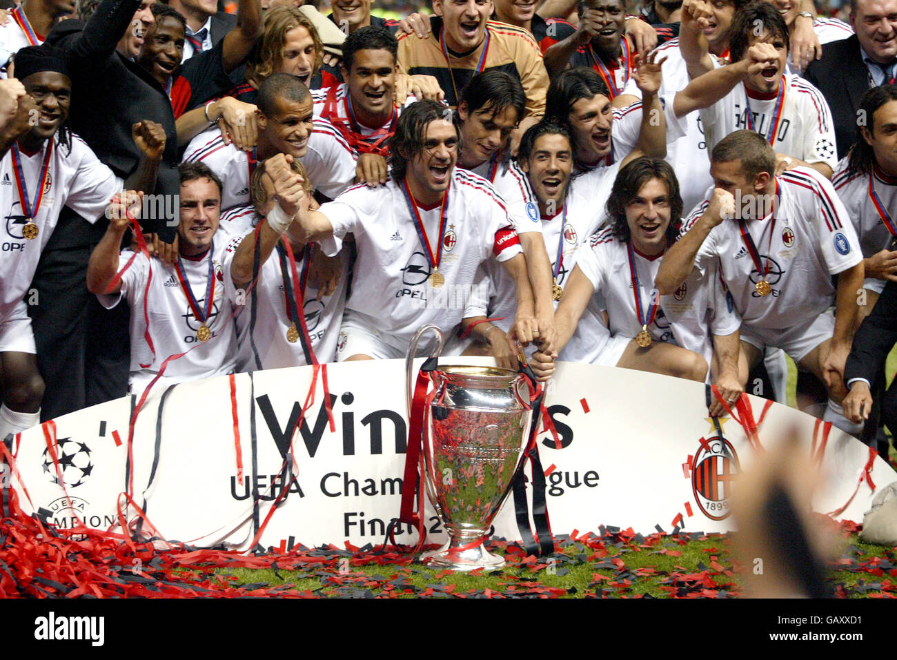 Soccer - UEFA Champions League - Final - Juventus v AC Milan. AC Milan players get their hands on the UEFA Champions League trophy as they celebrate their win against Juventus (c) captain Paolo Maldini Stock Photo