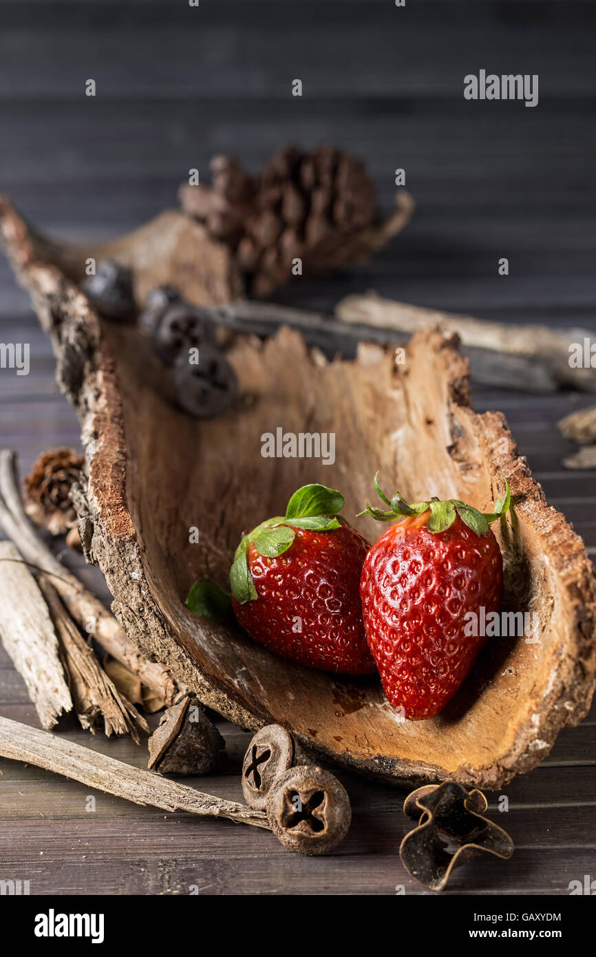 Strawberries with rustic decor in a wooden table. Vertical image Stock ...
