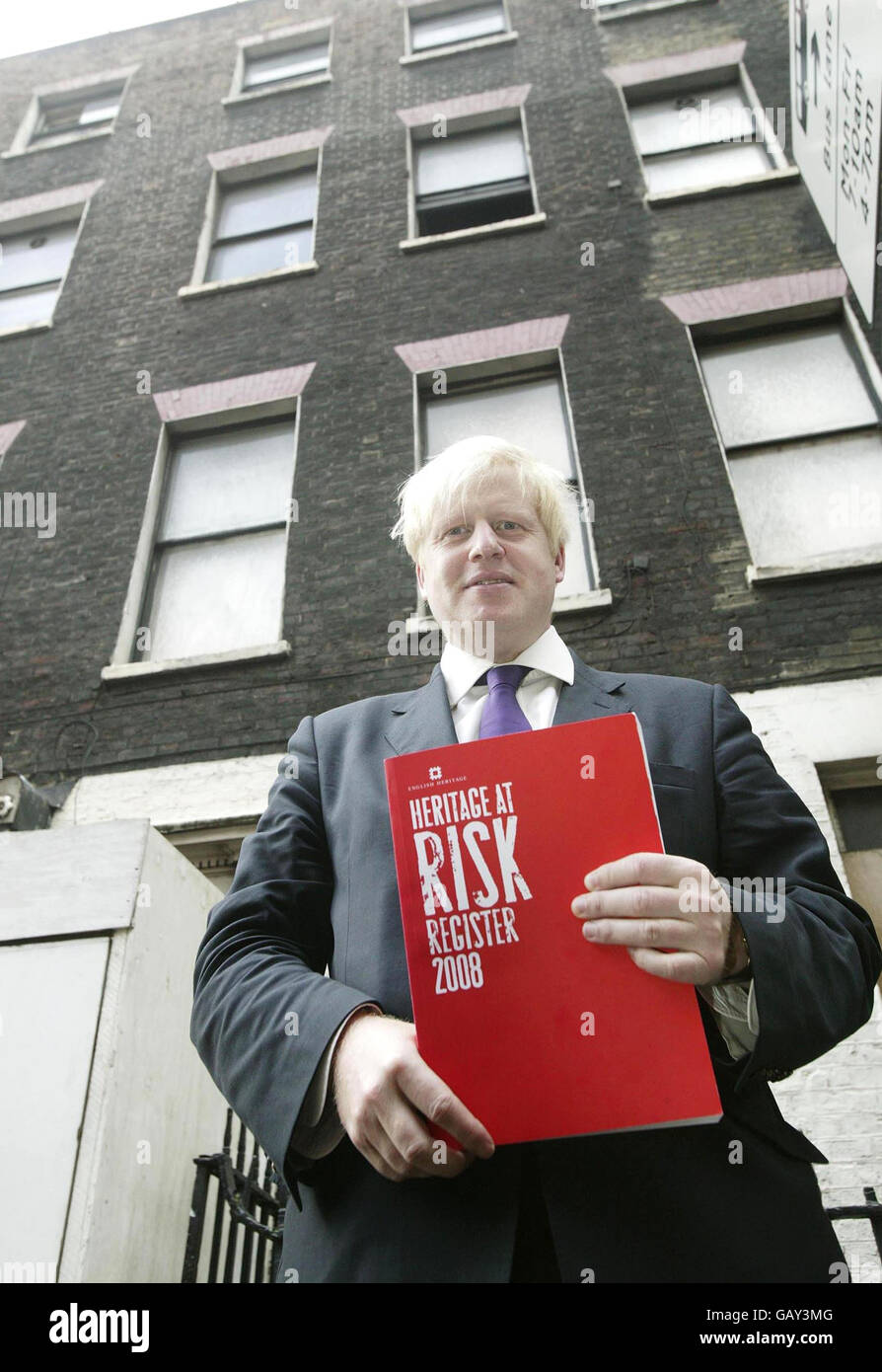 London Mayor Boris Johnson, with the Heritage At Risk Register outside