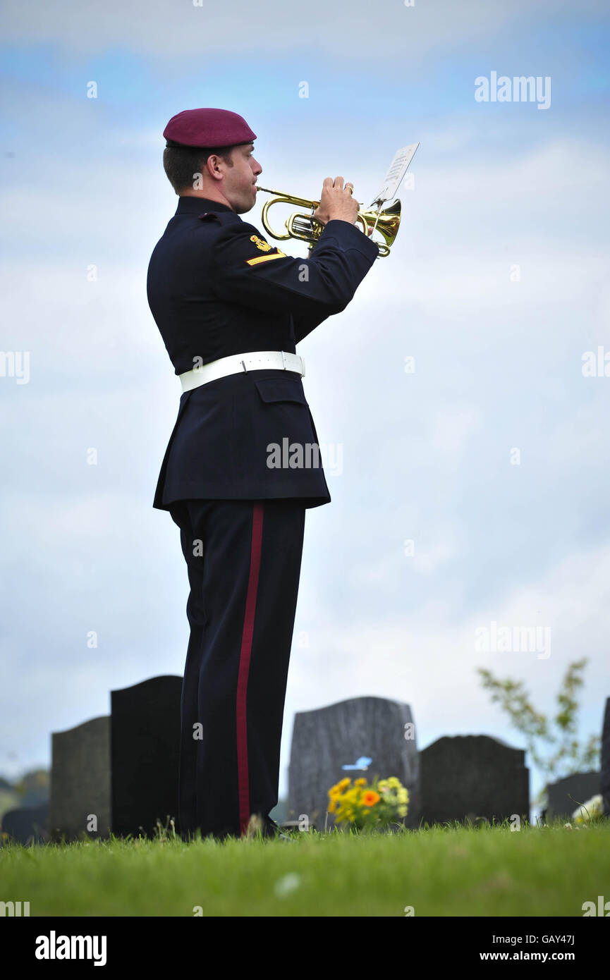 A bugler plays the Last Post during the funeral of Warrant Officer Class 2 Michael Williams at the Bedwas cemetery, Caerphilly. Stock Photo