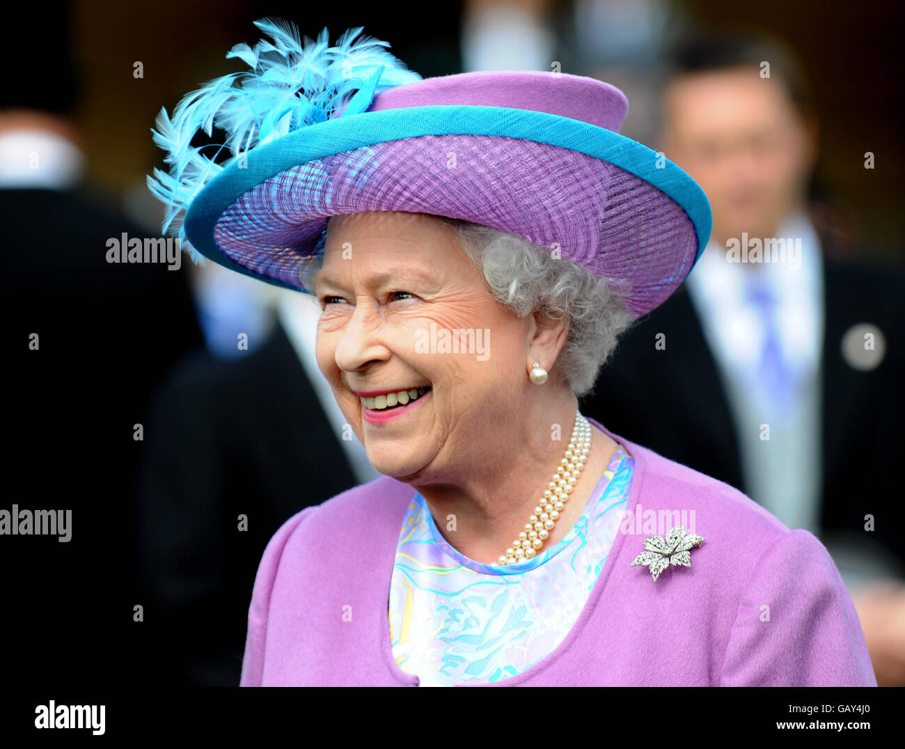 Britain's Queen Elizabeth II arrives to host a garden party in the grounds of Buckingham Palace, London. Stock Photo