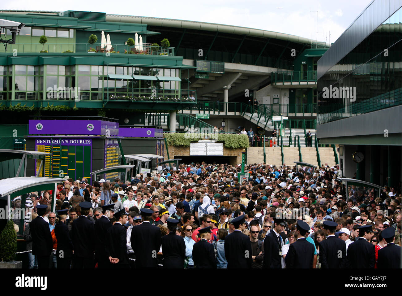 Tennis - Wimbledon Championships 2008 - Day Three - The All England Club. Marshalls hold the crowd back prior to the days play Stock Photo