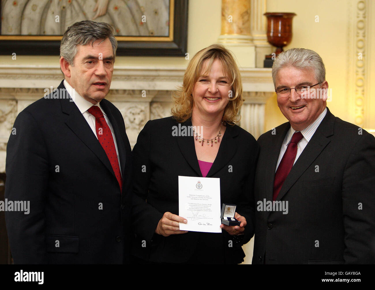 Prime Minister Gordon Brown and Defence Secretary Des Browne present a Veterans Award to Erica Ferguson, Royal Air Force, at a Downing Street reception ahead of Veterans Day on June 27th. Stock Photo