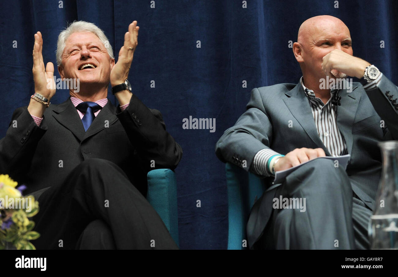 President Bill Clinton shares a platform with Sir Tom Hunter at the Department for International Development in London today where they announced a new partnership to end rural poverty in Rwanda and Malawi. Stock Photo