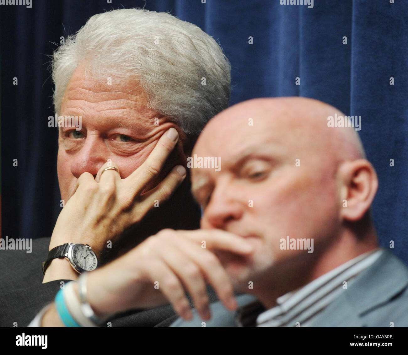 President Bill Clinton shares a platform with Sir Tom Hunter at the Department for International Development in London today where they announced a new partnership to end rural poverty in Rwanda and Malawi. Stock Photo