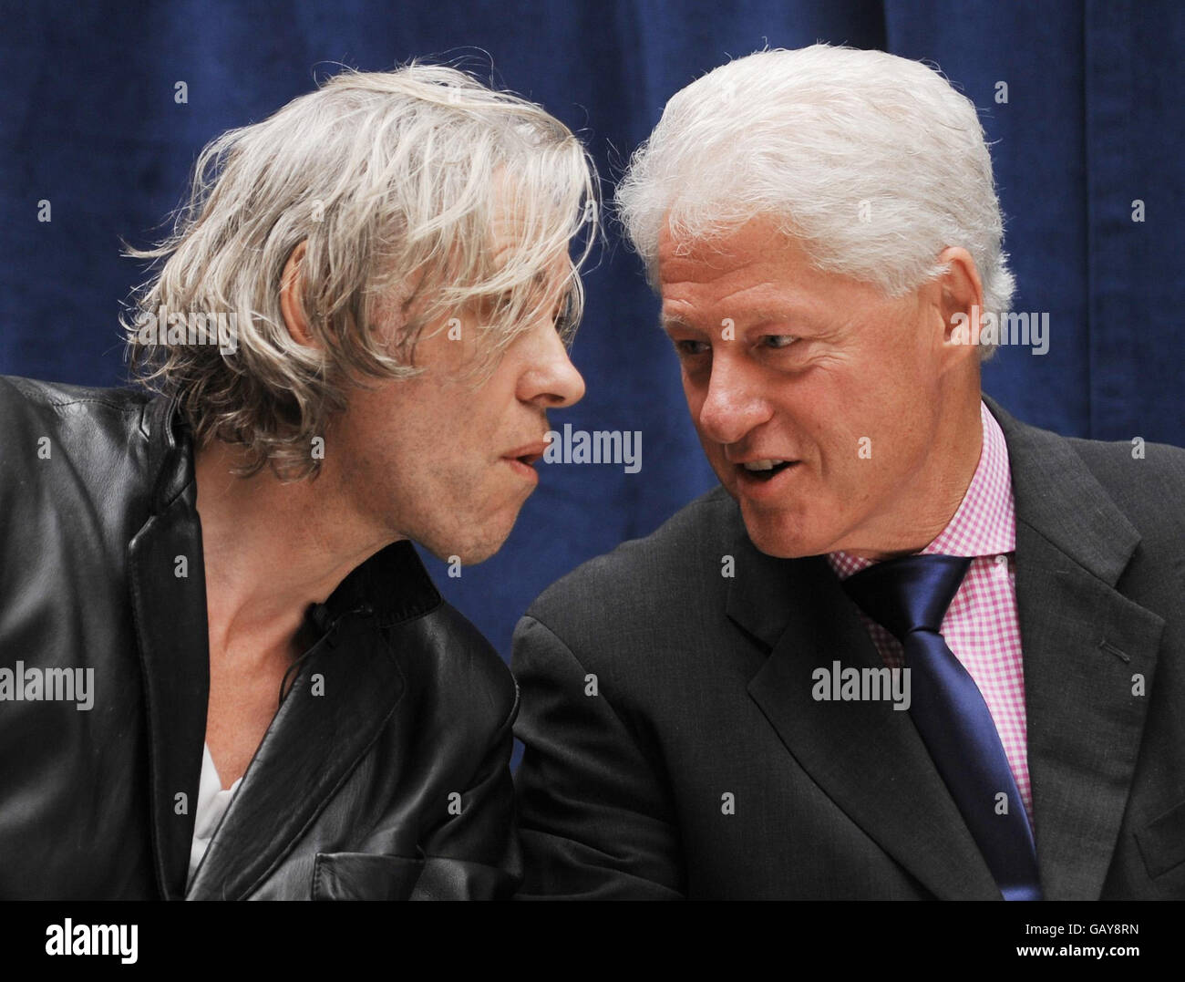 President Bill Clinton shares a platform with Sir Bob Geldof at the Department for International Development in London today where they announced a new partnership to end rural poverty in Rwanda and Malawi. Stock Photo