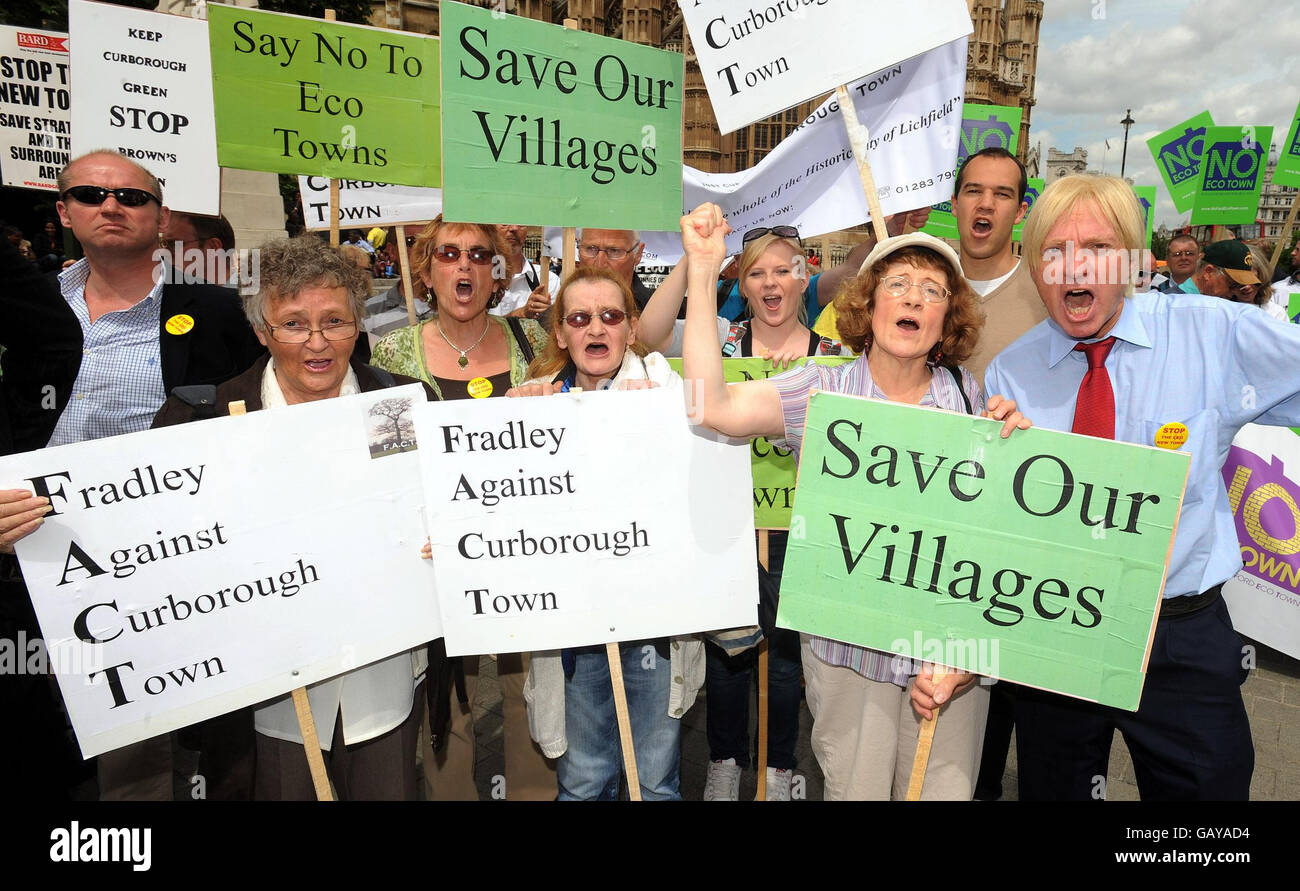Michael Fabricant MP (right) joins a group of protesters from Fradley outside the Houses of Parliament, in London, to voice their opposition for plans to build new eco-towns in their county of Staffordshire. Stock Photo