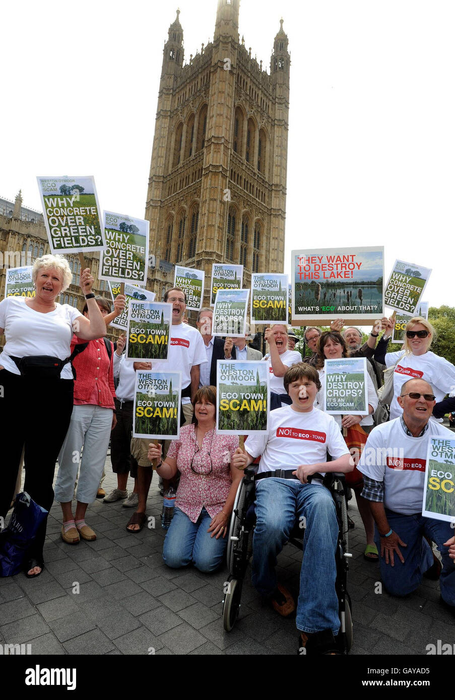 A group of protesters from Weston outside the Houses of Parliament, in London, voice their opposition for plans to build new eco-towns in their county of Oxfordshire. Stock Photo