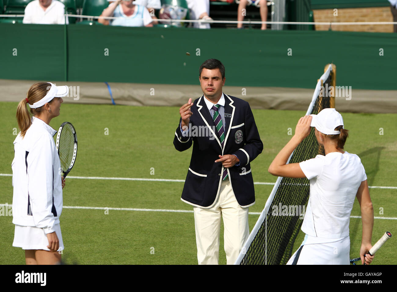 The Match umpire tosses the coin in the air at the start of the match between Maret Ani and Mara Santangelo Stock Photo