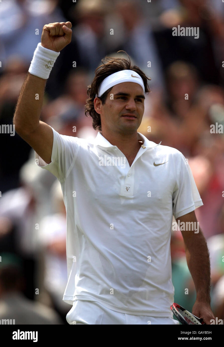 Switzerland's Roger Federer celebrates victory against Australia's Lleyton Hewitt during the Wimbledon Championships 2008 at the All England Tennis Club in Wimbledon. Stock Photo