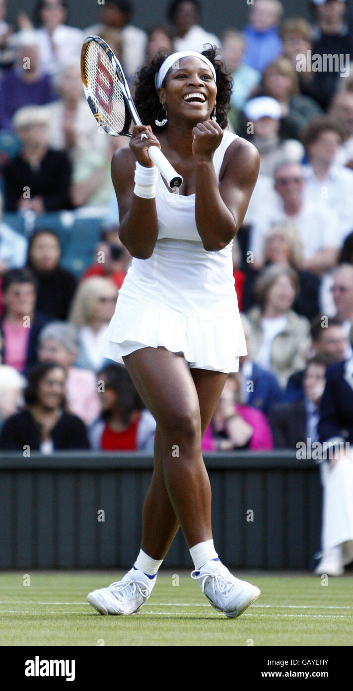 Beautiful Female Tennis Player Wearing A Headband Holding Her