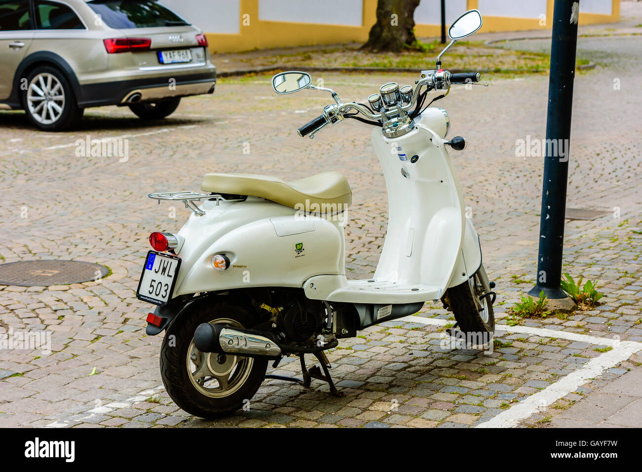 Motala, Sweden - June 21, 2016: Baotian retro 2013 moped parked in the street.. Stock Photo