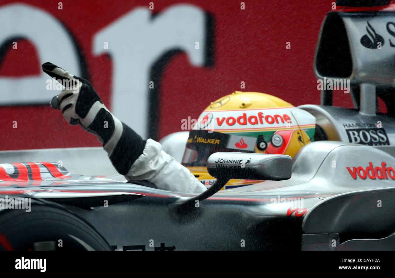 McLaren's Lewis Hamilton celebrates winning the British Grand Prix at