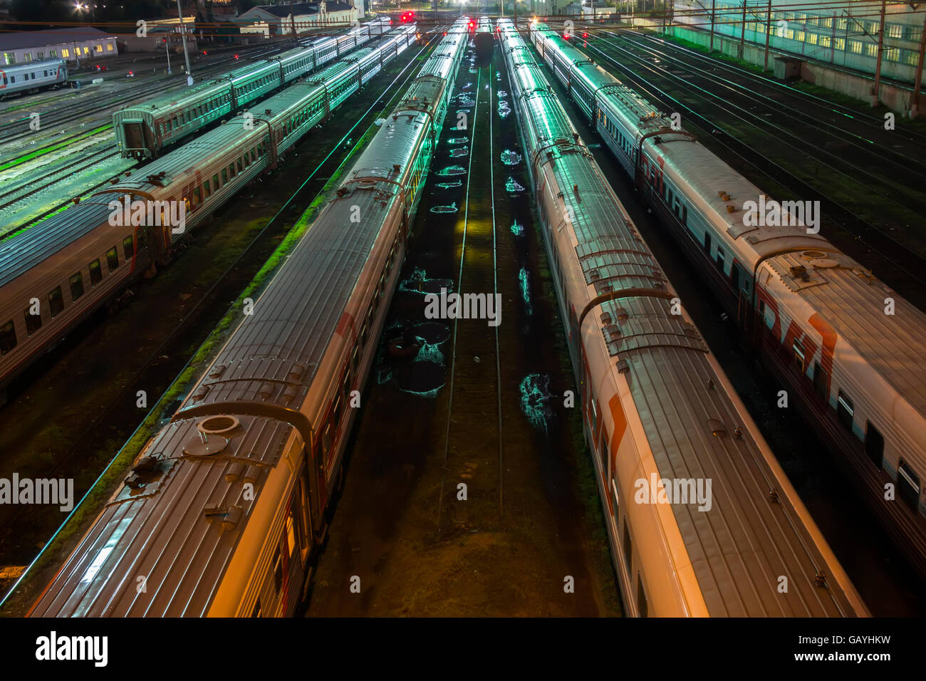 trains in railway junction at night Stock Photo - Alamy