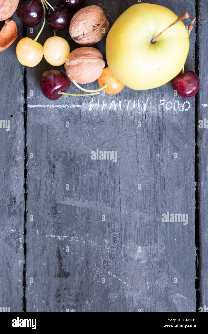 Fruits on rustic background, food background Stock Photo - Alamy