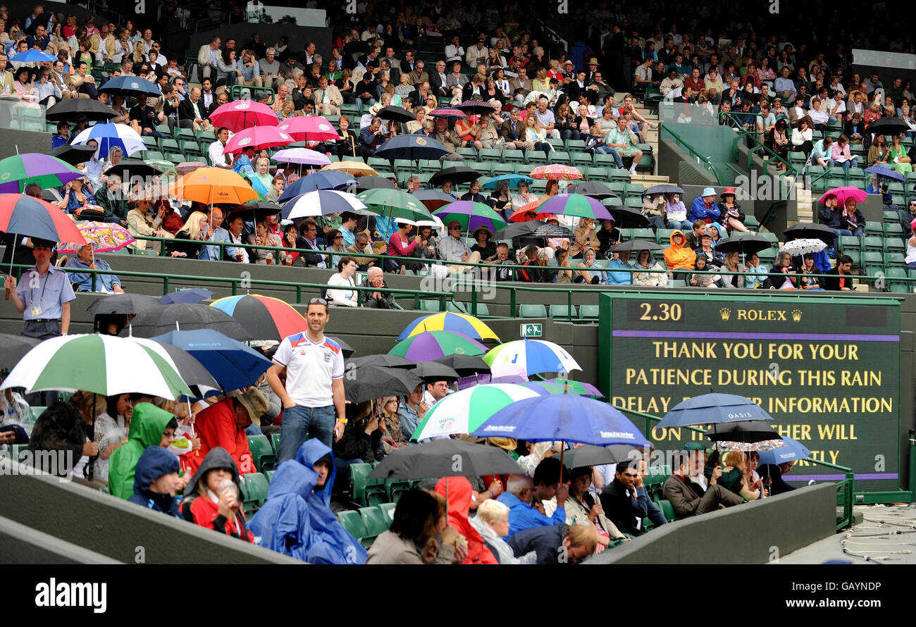 Rain delays play on Court One during the Wimbledon Championships 2008 at the All England Tennis