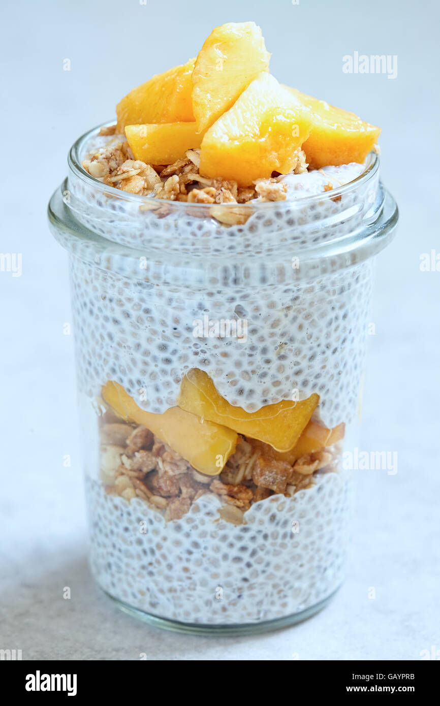 Chia pudding with peach slices in a jar Stock Photo