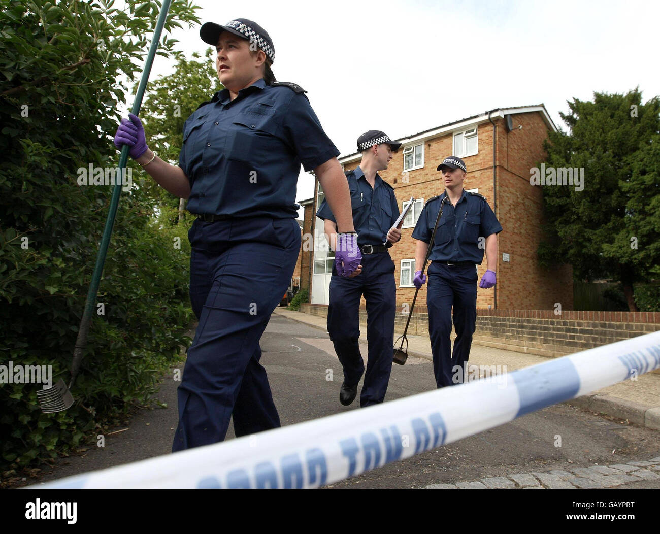 Police carry out an investigation at the scene where 16-year-old Shakilus Townsend was stabbed yesterday in Beulah Crescent, Thornton Heath, south London. Stock Photo