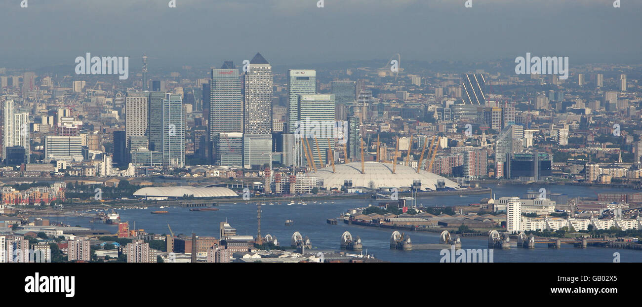 Aerial photo looking west towards central London, including Canary Wharf, the O2 Arena, formerly known as the Millennium Dome, and the Thames Barrier. Stock Photo