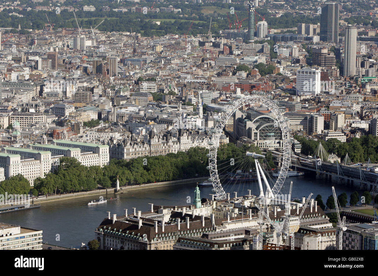 Aerial photo of the London Eye, and Hungerford Bridge, alongside the river Thames, London. Stock Photo