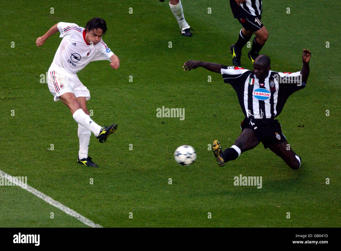 Soccer - UEFA Champions League - Final - Juventus v AC Milan. AC Milan's Filippo Inzaghi (l) gets in a shot despite the attention of Juventus' Lilian Thuram Stock Photo