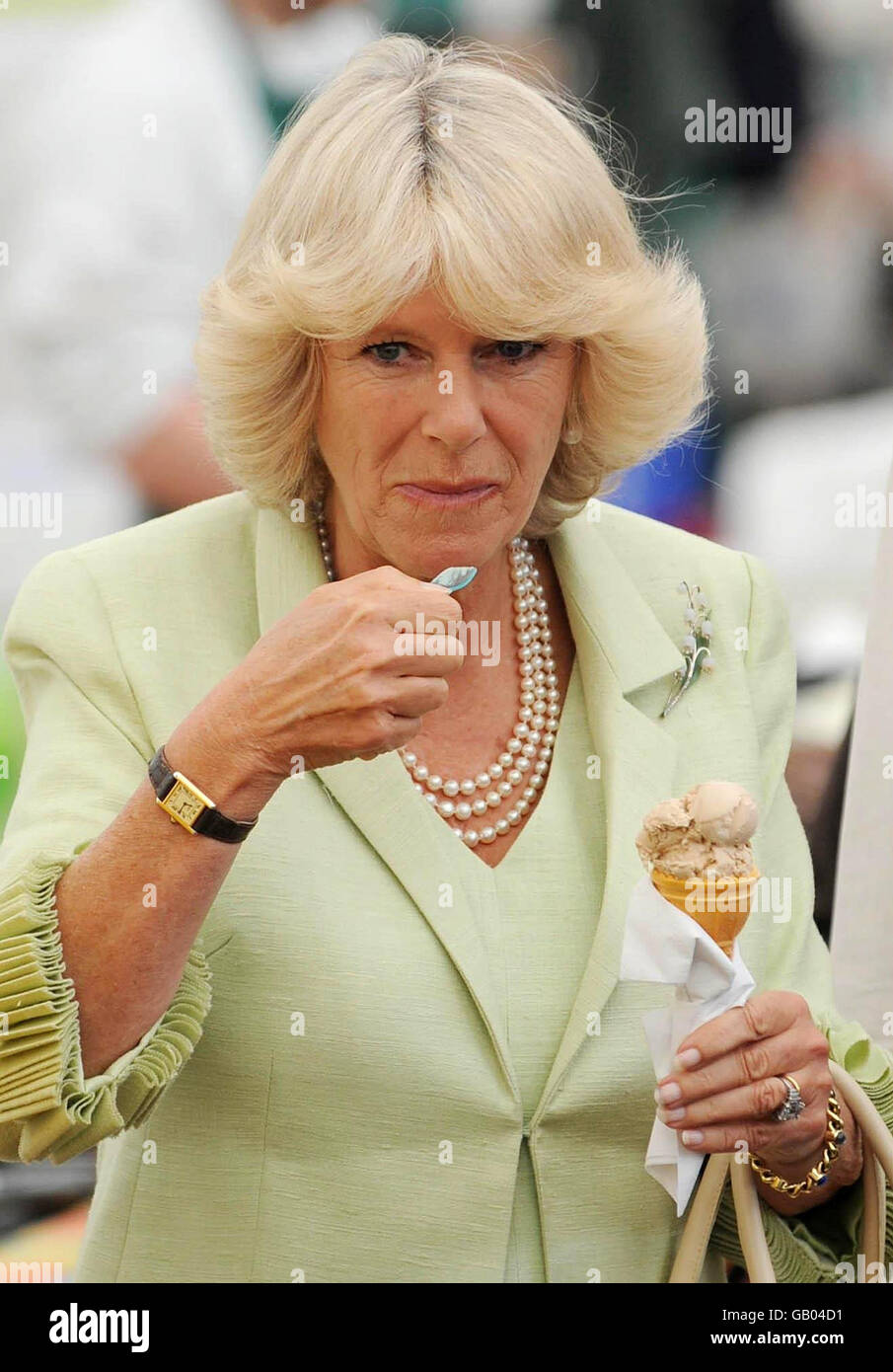 The Duchess of Cornwall tastes some icecream during her tour of the