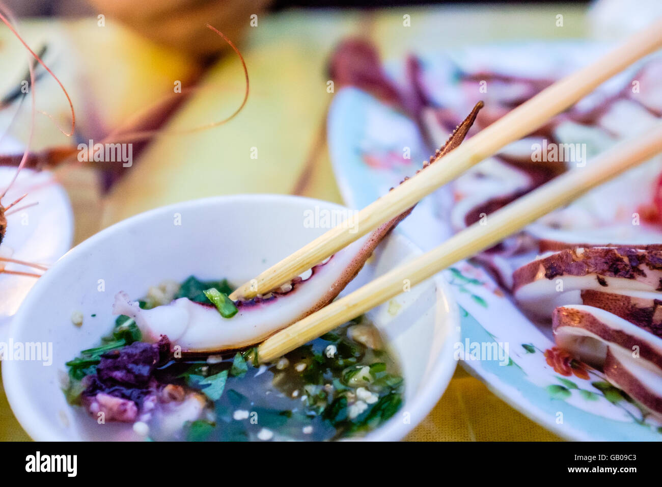 Delicious plate of Charcoal Grilled Squid Tentacle in Dipping Sauce