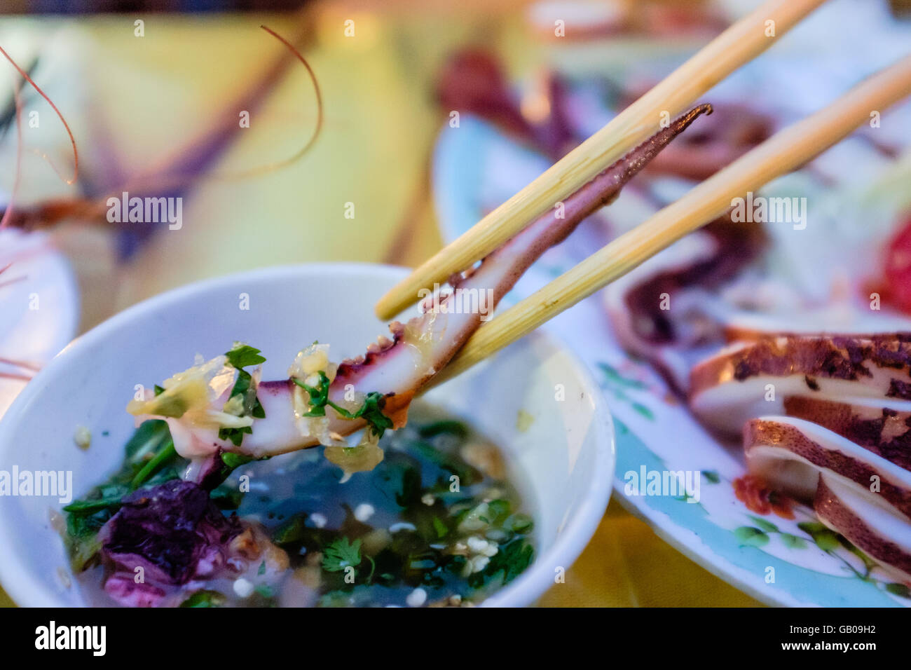 Delicious plate of Charcoal Grilled Squid Tentacle in Dipping Sauce