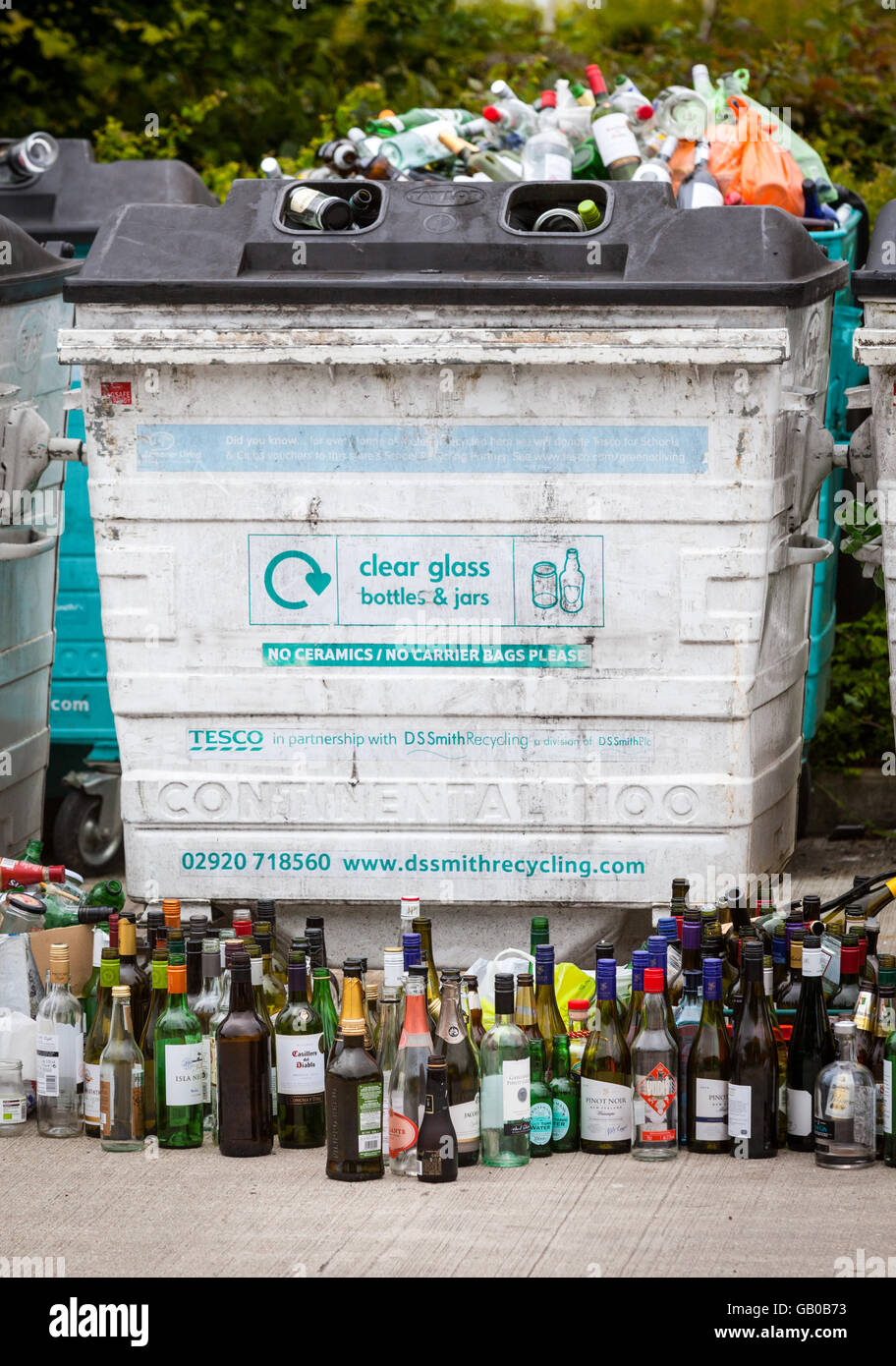 Overflowing recycling glass bottle bank in Winchester, UK with rows of