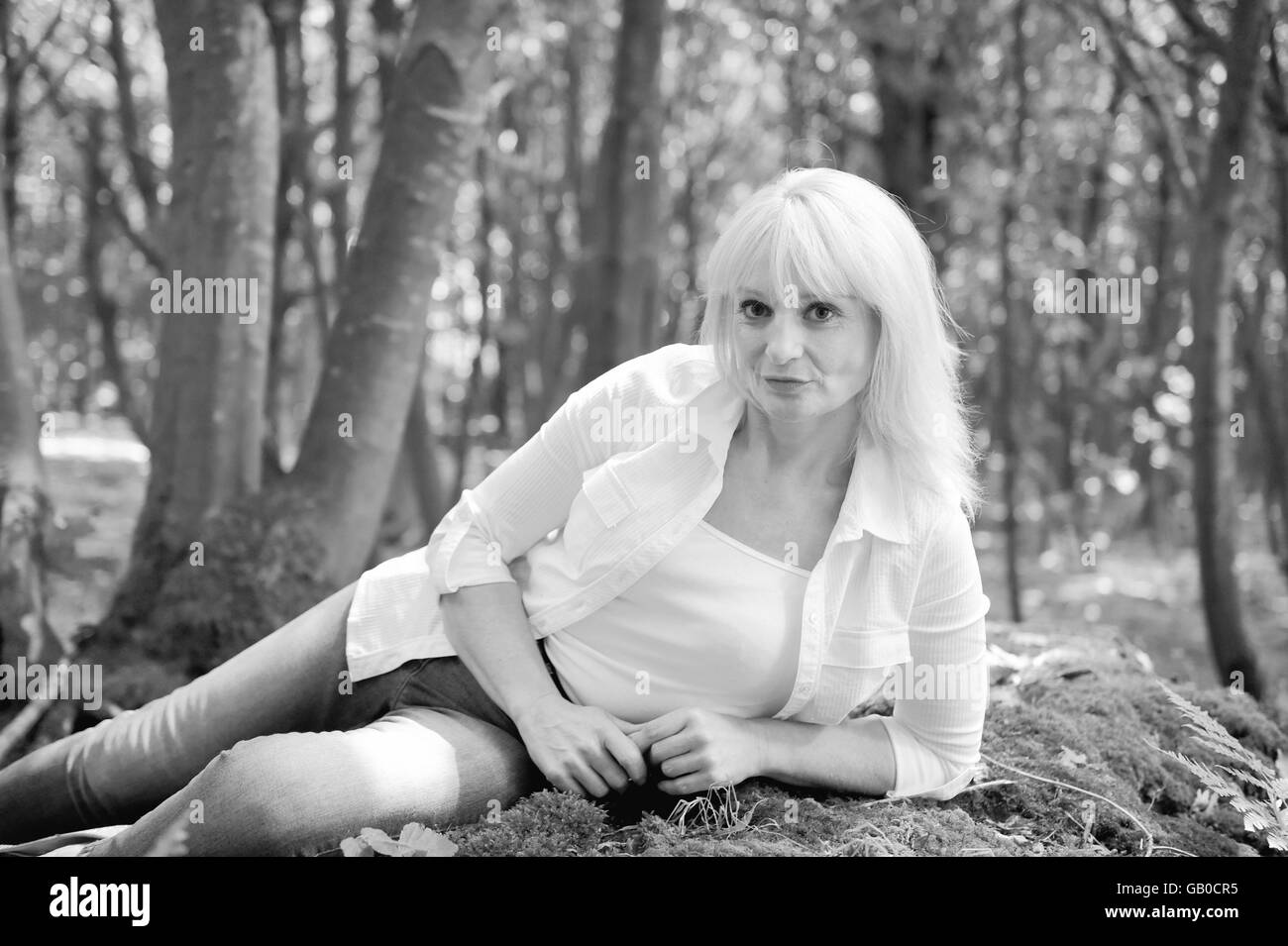 Beautiful mature woman posing in hi-res stock photography and images ...