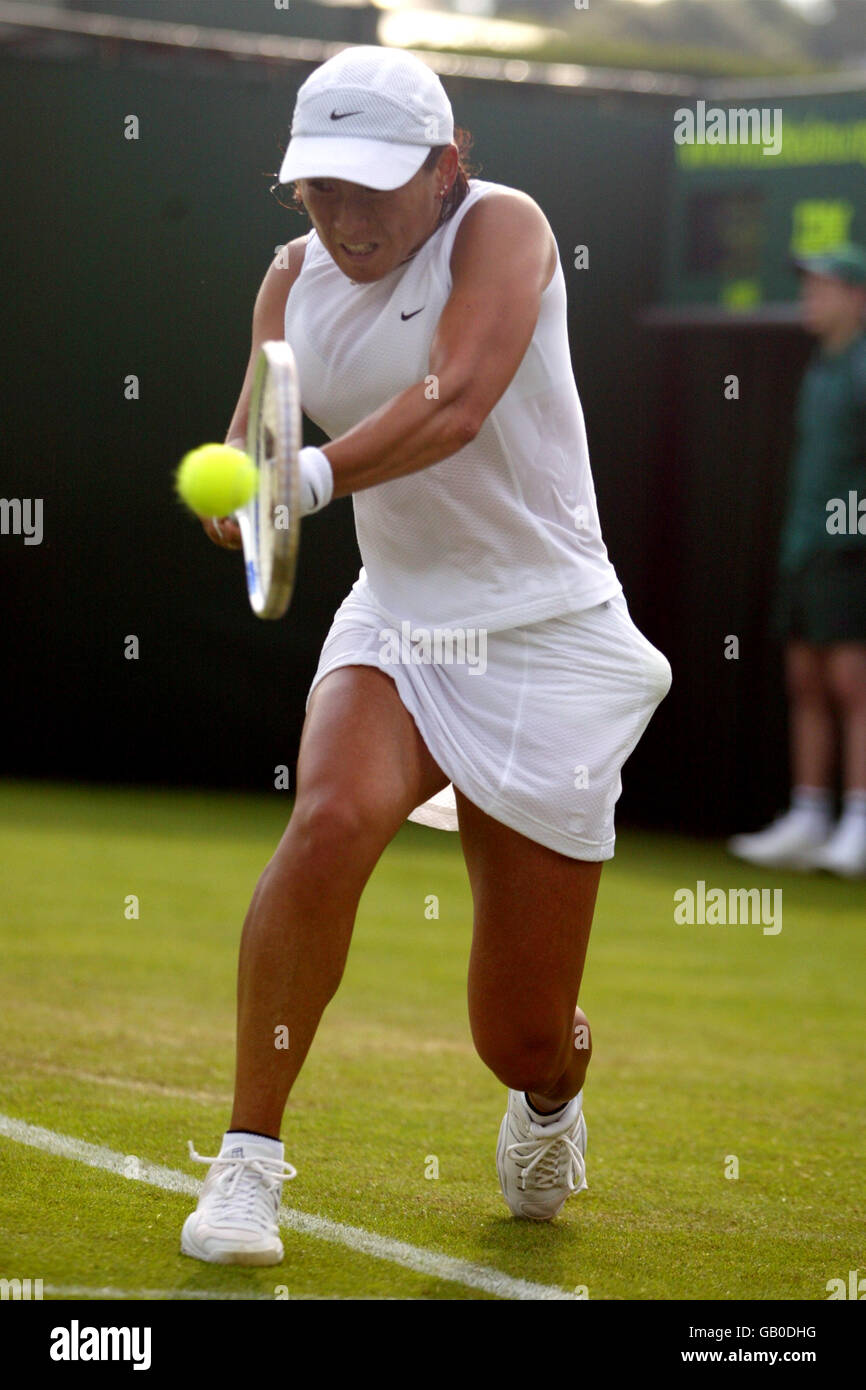 Tennis - Wimbledon 2003 - Women's First Round - Lucie Ahl v Ai Sugiyama. Ai Sugiyama returns to Lucie Ahl Stock Photo