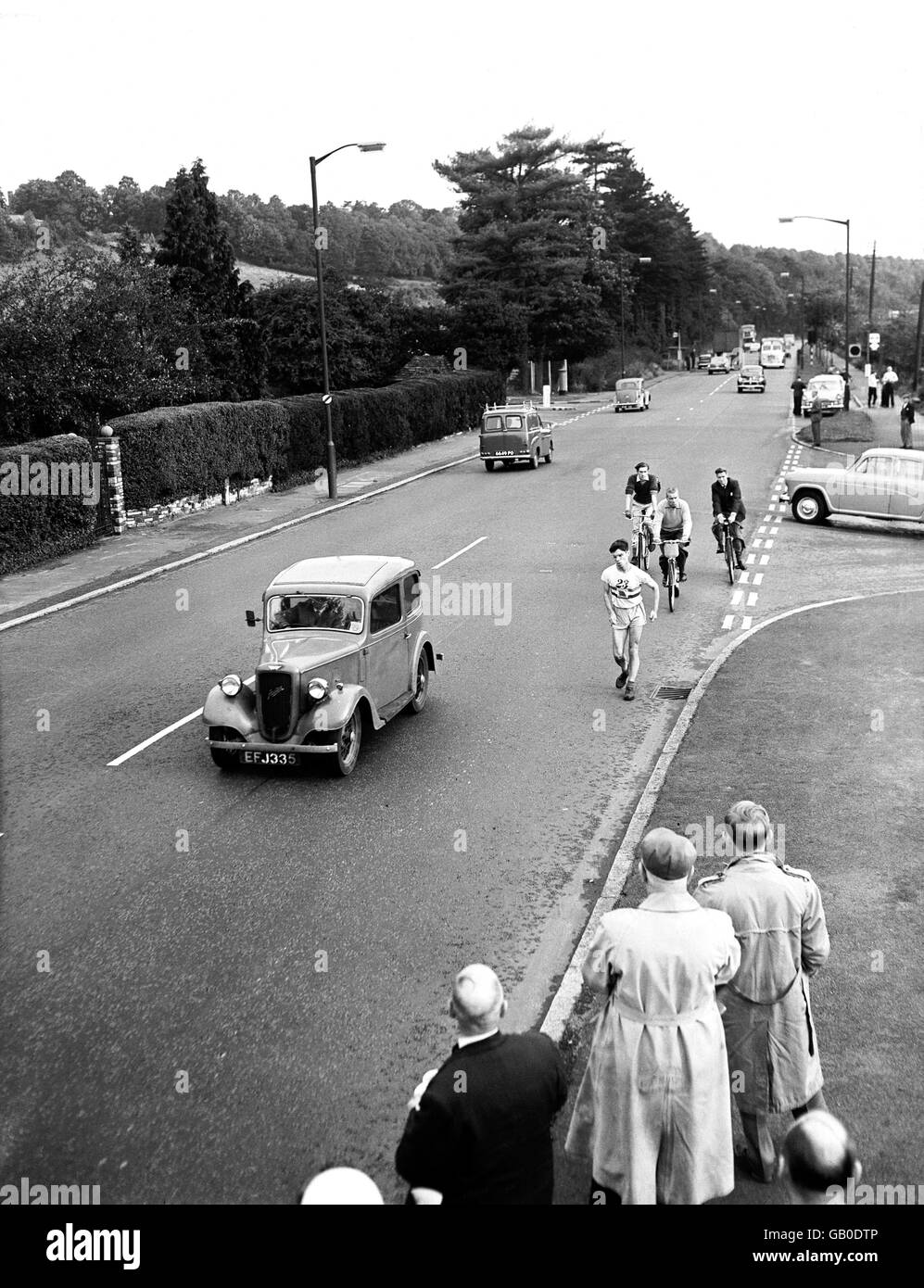 Olympic 50km champion Don Thompson strides out along the Brighton road at Coulsden Stock Photo