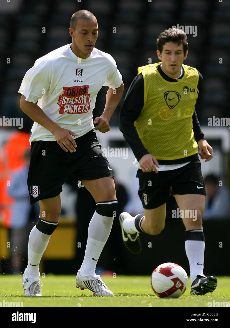 Fulham's Bobby Zamora (l) and team mate Andranik Teymourian warm up prior to kick off Stock Photo