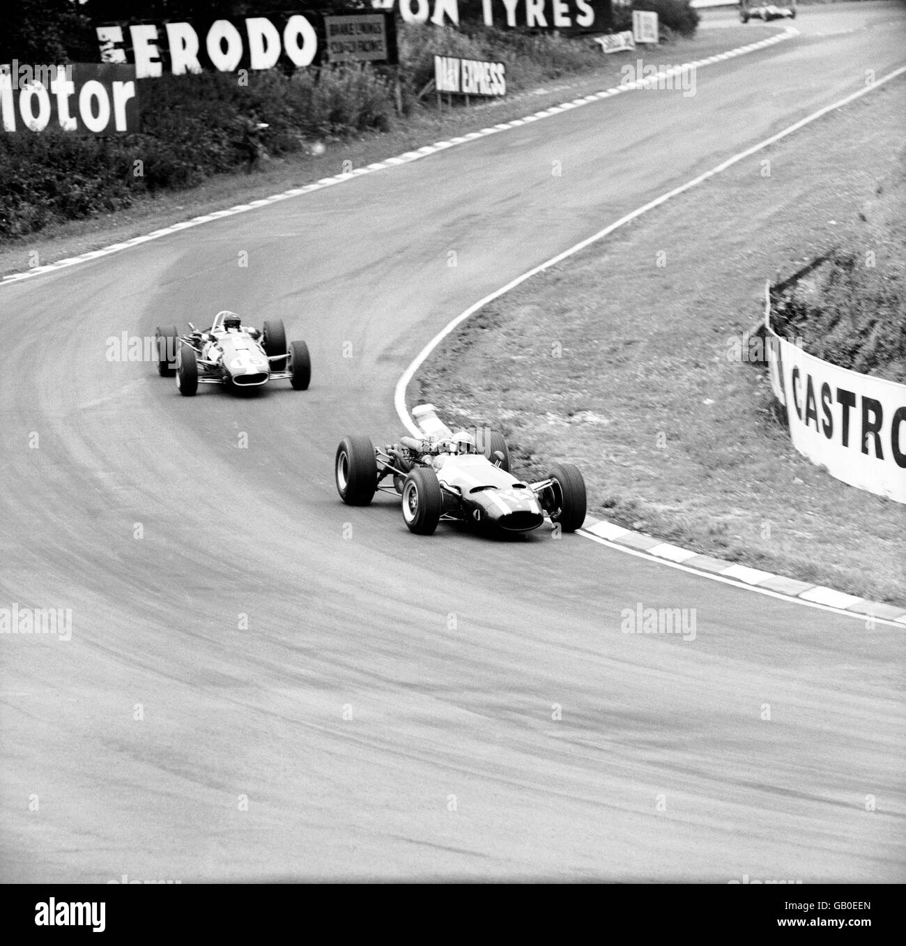 Formula One Motor Racing - British Grand Prix. John Surtees (r), in his Cooper Maserati, leads from Dan Gurney (l), in an Eagle Stock Photo