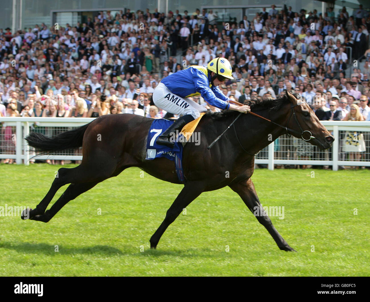 Perfect Stride ridden by Ryan Moore goes clear of the field to win The Emirates NBD Cup Class 2 at Ascot Racecourse, Berkshire. Stock Photo
