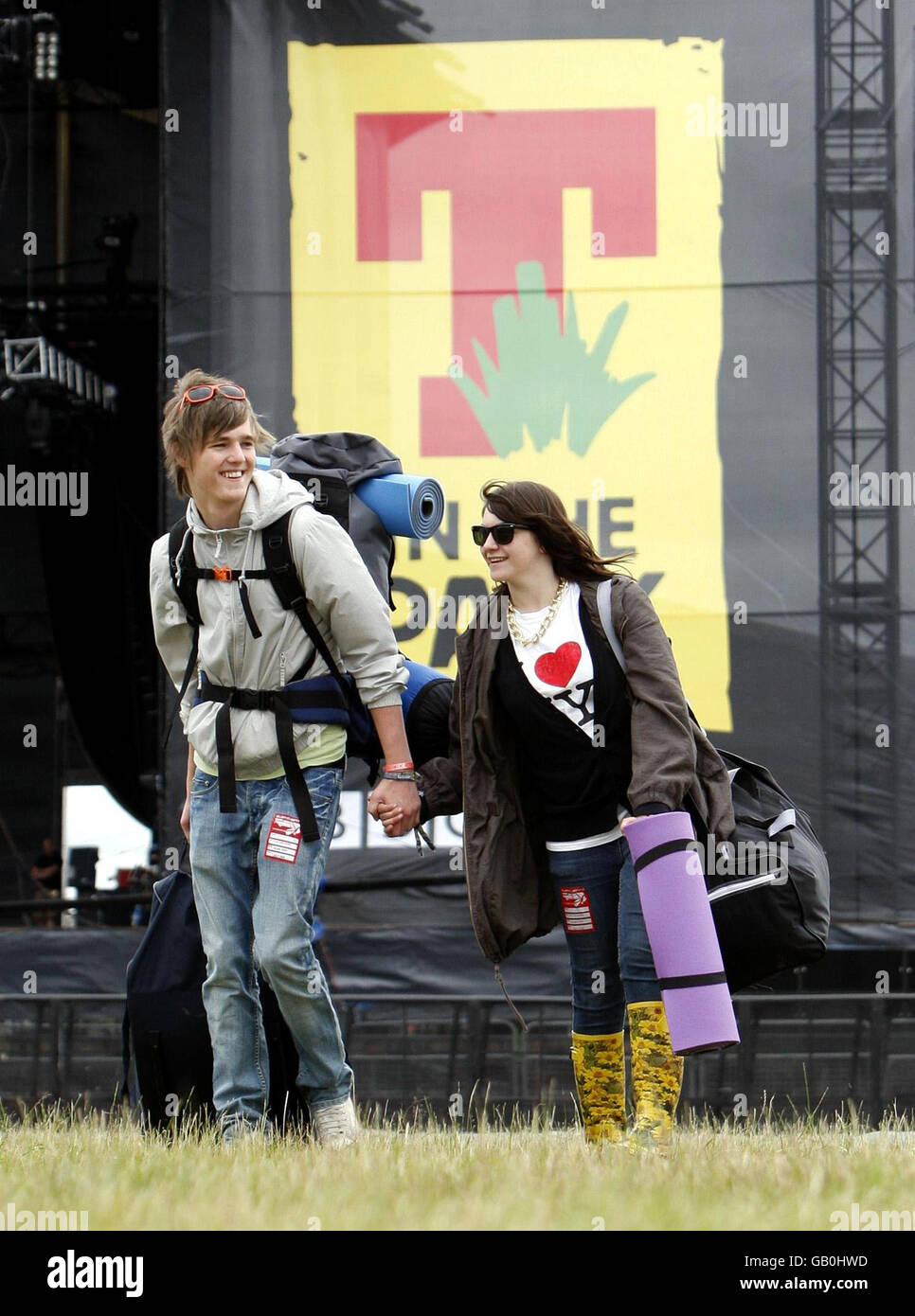 Robert Cartwright, 18, and Melissa Purcell, 18, arrive at the T in the Park music festival near Kinross in Scotland. Stock Photo