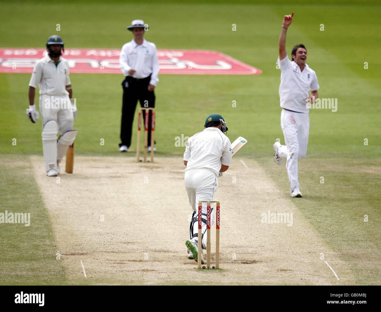 England bowler James Anderson celebrates taking the wicket of bottom Neil McKenzie during The First npower Test match at Lord's Cricket Ground, London. Stock Photo