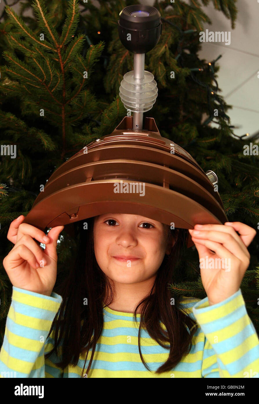 Olivia Thanki, 9, plays with Doctor Who Dalek voice changing mask, at the unveiling of Hamleys must have toy range for Christmas 2008, at the Good Housekeeping Institute, Broadwick Street, London. Stock Photo