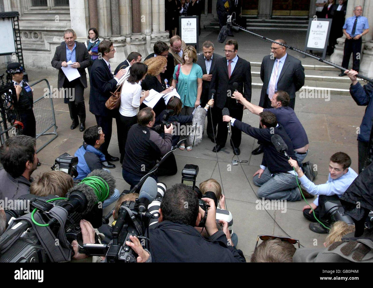 Robert Murat (centre) makes a statement to the media outside the High Court, central London. He today accepted 'very substantial' libel damages from several news outlets over allegations that he was involved in the abduction of Madeleine McCann. Stock Photo