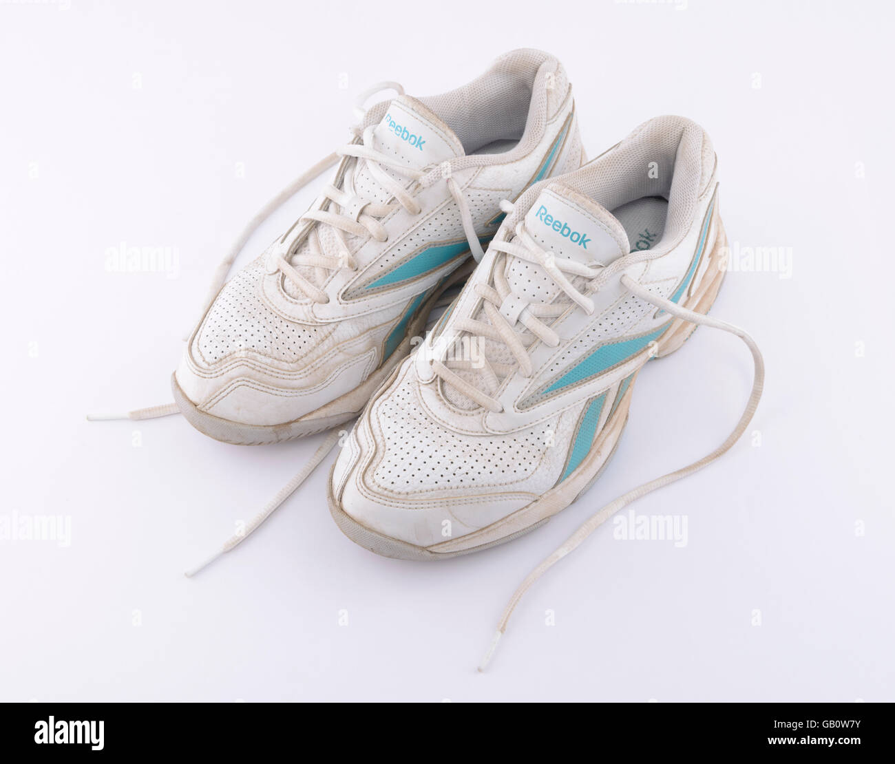 Pair of old Reebok running shoes isolated on white background Stock Photo -  Alamy