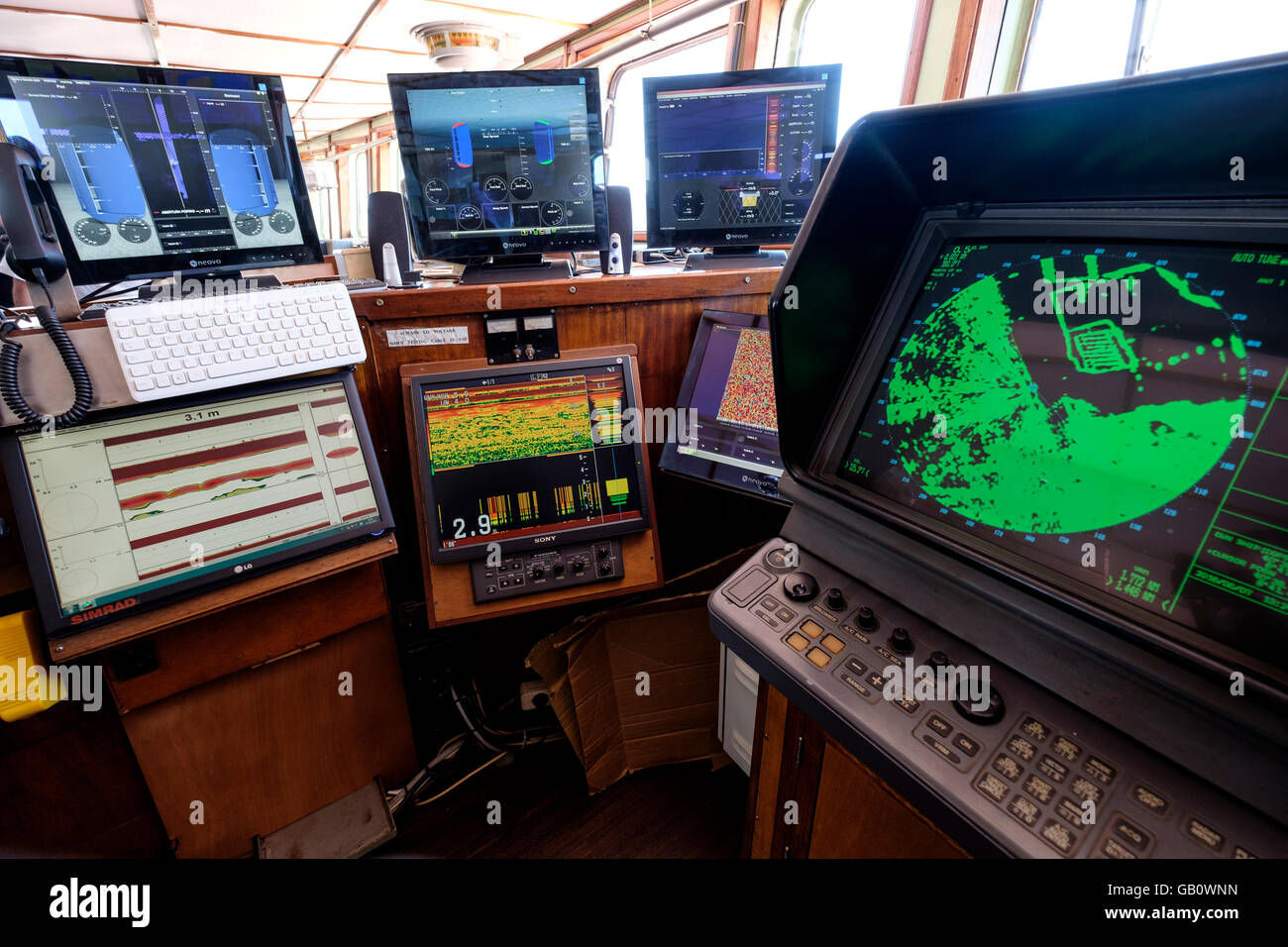 Modern radar navigation system on the bridge of a ship Stock Photo