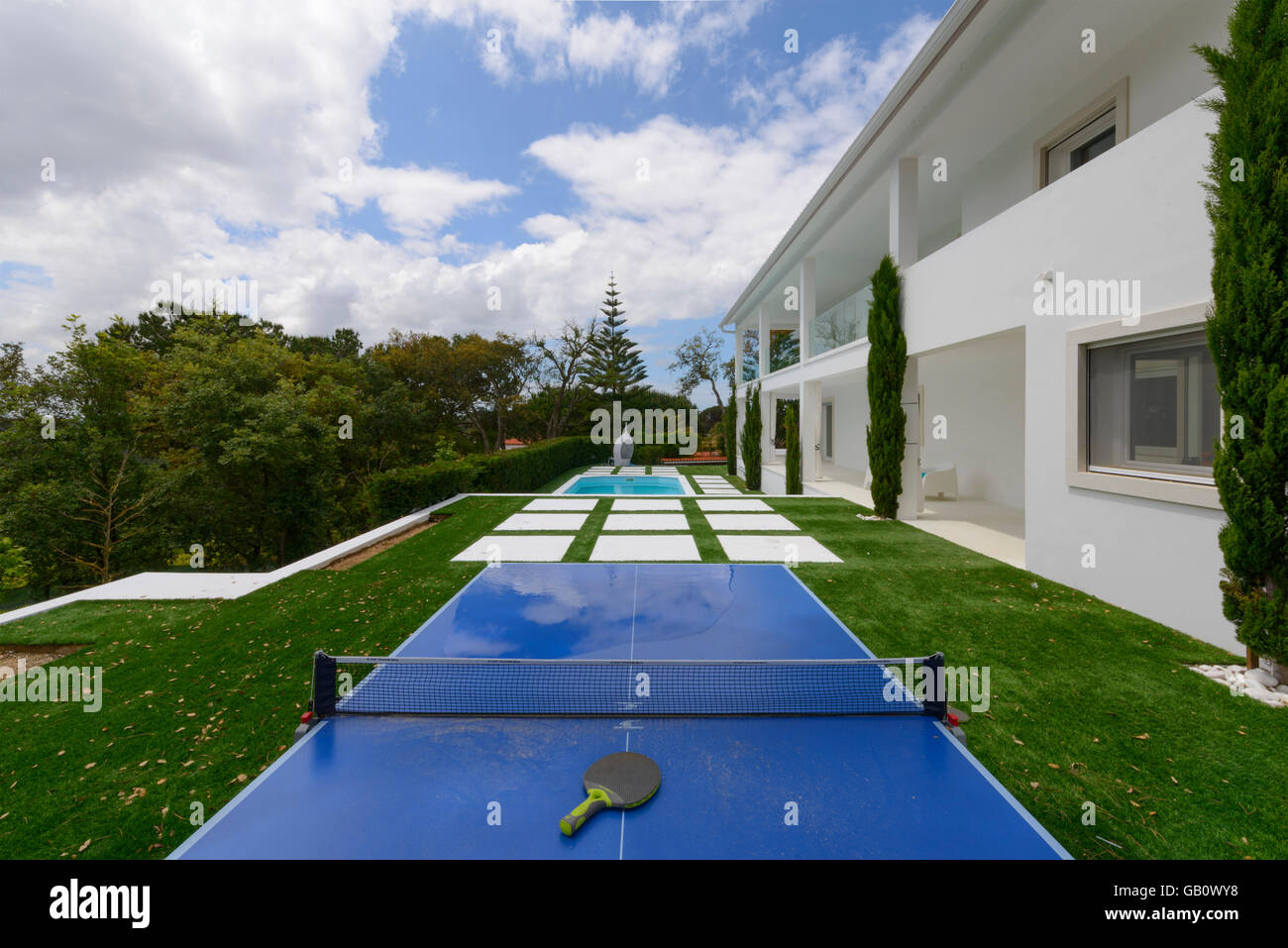 Ping pong table in the garden outside a isolated house Stock Photo