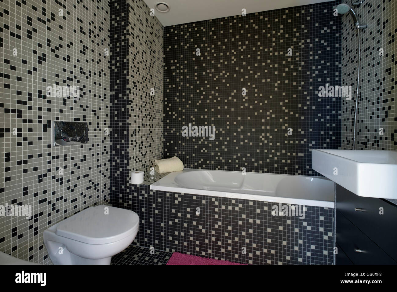 Modern bathroom with dark tiles Stock Photo Alamy