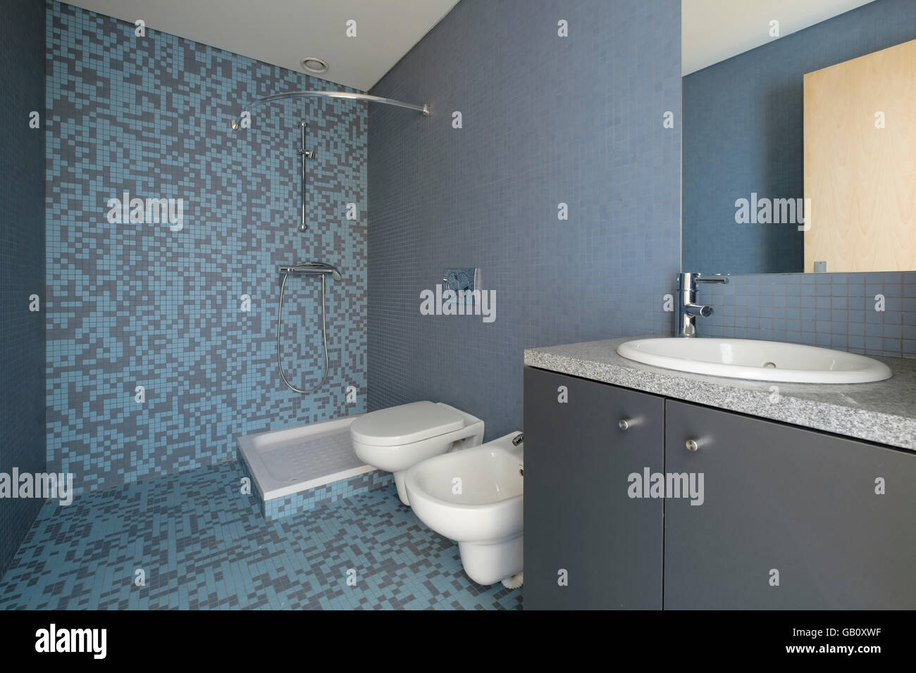 Modern bathroom with blue tiles Stock Photo