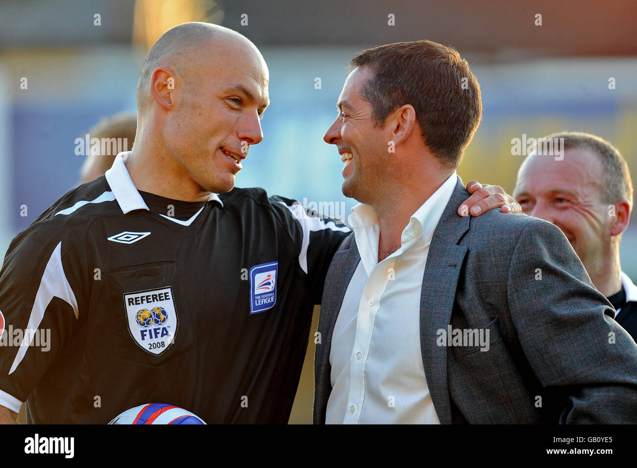 Hull City manager Phil Brown (right) and match referee Howard Webb ...