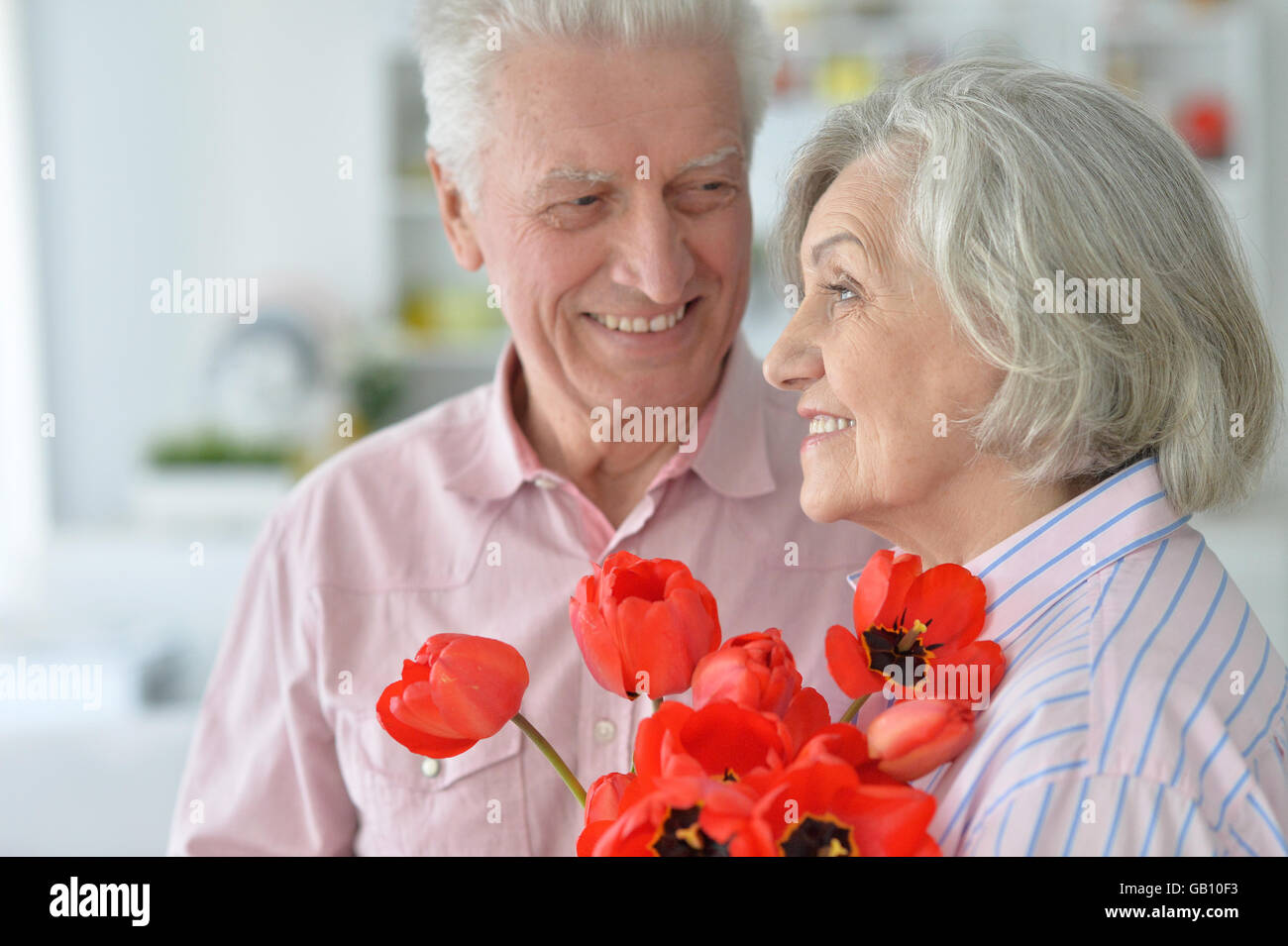 Mature couple with poppies Stock Photo