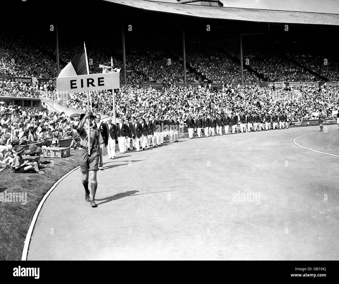 The Eire team marching around the stadium in the parade of competitors during the opening ceremony of the Olympic Games at Wembley. Stock Photo